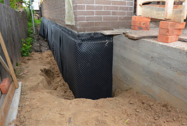 SJ Waterproofing Pros technician performing targeted Interior Drainage System assessment in Lakewood, SC